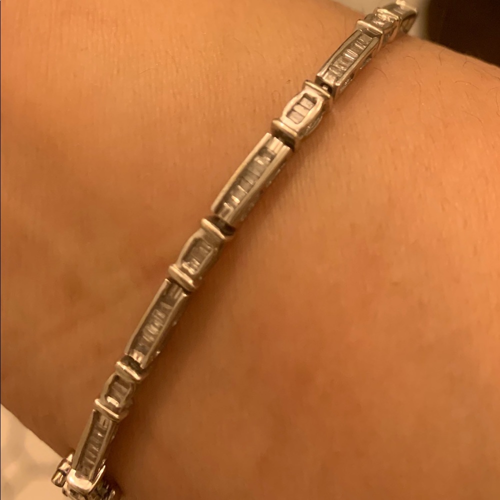 Solid 14 karat white gold with baguette diamonds